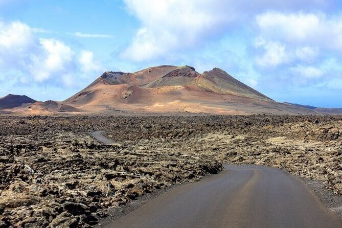 Lanzarote Volcanoes Tour departing from Fuerteventura - Getting there: air-conditioned coach and included boat transfer